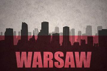 abstract silhouette of the city with text Warsaw at the vintage polish flag