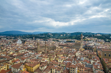 Naklejka na ściany i meble Florence cityscape on a cloudy landscape in Tuscany