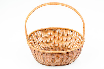Empty wooden woven fruit or bread basket on white background. Wicker basket. Plaited container....