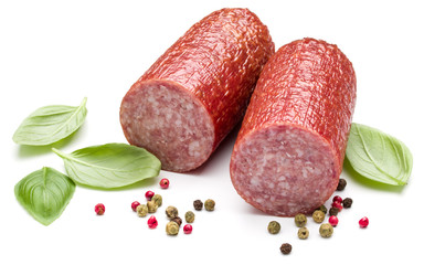 Salami smoked sausage, basil leaves and peppercorns isolated on