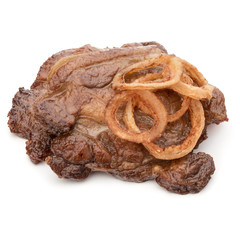 Cooked fried pork meat with onion slices garnish isolated on whi