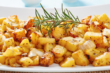 Baked potatoes on square white dish