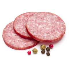 Salami smoked sausage three slices and peppercorns isolated on w