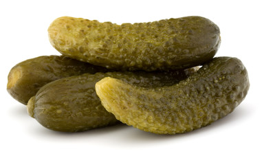 pickled or marinated  cucumbers isolated on white background cut