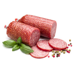 Salami smoked sausage, basil leaves and peppercorns isolated on