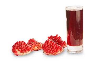 delicious juice from ripe pomegranate in beautiful glass on wood