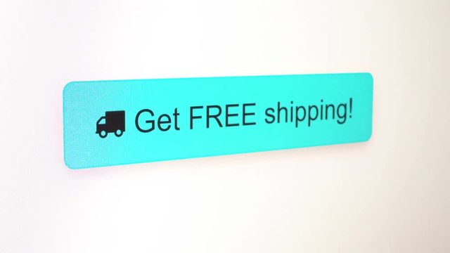 Get Free Shipping - button click video shot close up, visible pixel grid of a computer screen as cursor pushes the button, several colors.