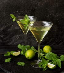 Martini or mint liqueur with lime, selective focus