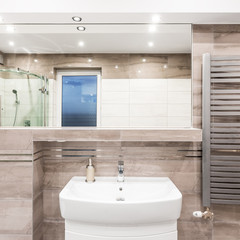 Beige bathroom with heater