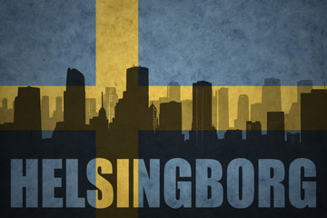 abstract silhouette of the city with text Helsingborg at the vintage swedish flag