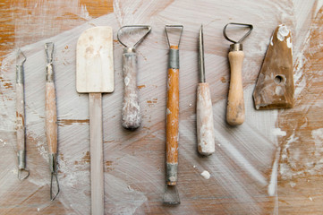 Work tools in a messy ceramics workshop