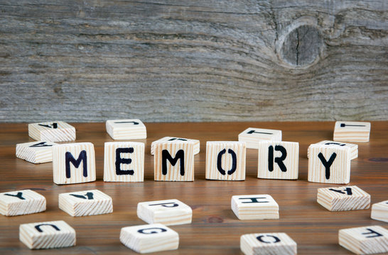 Memory from wooden letterson on wooden background