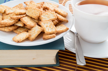View close-up on a cup of tea and dry crackers