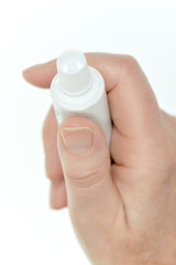 Applying cream to hand