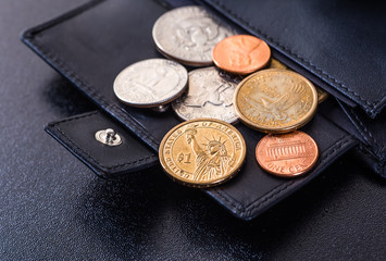 dollars bills in wallet isolated on black