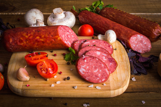 Sausage on a wooden background