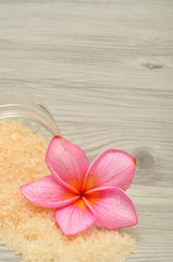 Fototapeta na wymiar Bath salt with a frangipani flower