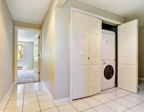 Hallway interior with built-in laundry appliances