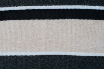 Fototapeta premium Knitwear striped in grey, black, beige, white. Textured backgrou