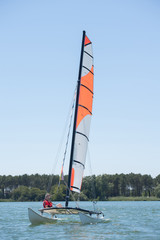 Naklejka premium sailing on a lake - summer and sports theme