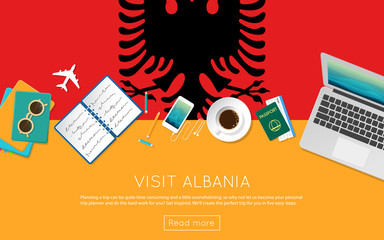 Visit Albania concept for your web banner or print materials. Top view of a laptop, sunglasses and coffee cup on Albania national flag. Flat style travel planninng website header.