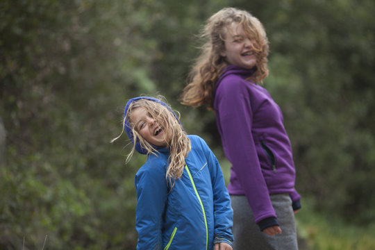 Two girls laughing while out on a hike.  San Diego, California.
