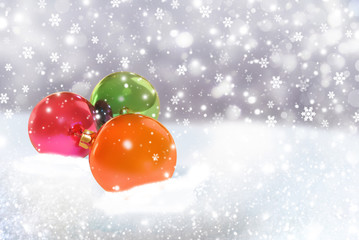 Christmas background with christmas balls on shine snow 