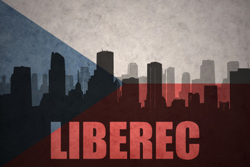 abstract silhouette of the city with text Liberec at the vintage czech republic flag