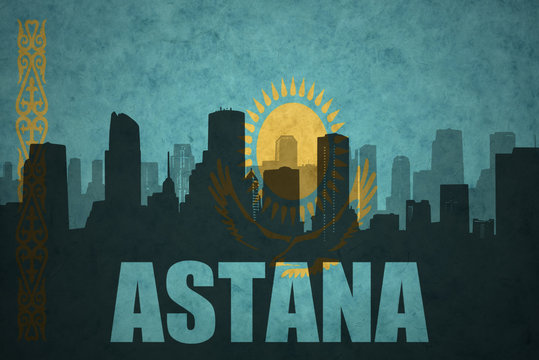 abstract silhouette of the city with text Astana at the vintage kazakhstan flag