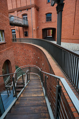 The metal structure  and brick wall in an old brewery in Poznan. © GKor