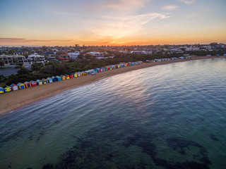 Aerial view of sunrise at Brighton Beach showing the suburb and bathing boxes. Melbourne, Victoria, Australia