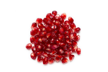 Fruit pomegranate seeds isolated on a white background top view closeup.