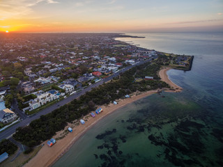 Aerial view of sunrise at Brighton Beach coastline. Melbourne, Victoria, Australia.