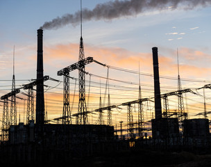 silhouette of coal electric power plant on the background of a beautiful sunset.