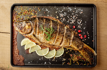 baked carp with spices top view