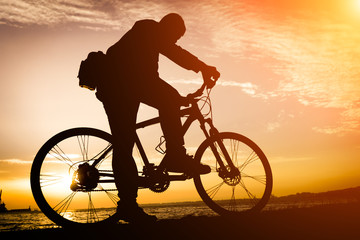 Fototapeta premium Silhouettes Of Biker