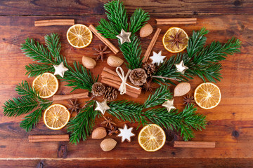 Christmas spices arrangement on rustic wooden background