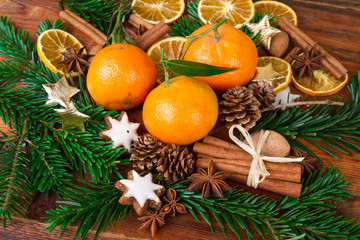 tangerines mandarins fruits with christmas spices ans fir branch