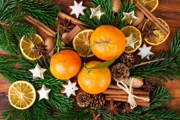 Christmas composition with tangerines fruits and spices top view