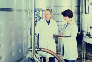 Man and woman check of equipment