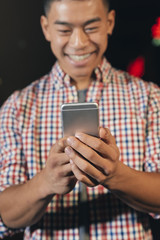 Handsome young man using his mobile.