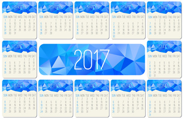 Year 2017 vector monthly calendar. Week starting from Sunday. Contemporary low poly design in blue color.