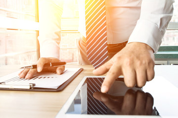 Businessman analyzing financial statements in the office