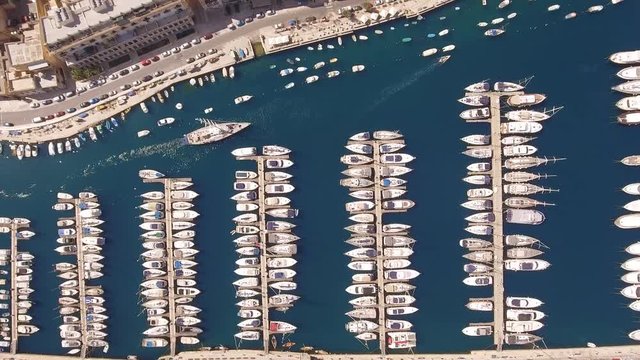 Aerial Footage Of Small Boats Moored At Harbor Drone Malta Travel Tourism Town Marine Yacht History Beautiful Mediterranean Luzzu Traditional