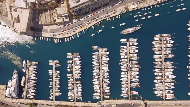Aerial Footage Of Boats Moored At Harbor Drone Malta Travel Tourism Town Marine Yacht History Beautiful Mediterranean Luzzu Traditional Marina