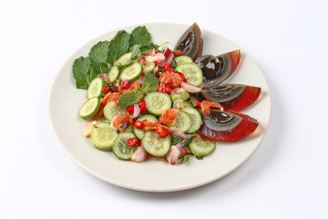 Spicy cucumber salad with dried shrimp and  preserved egg.