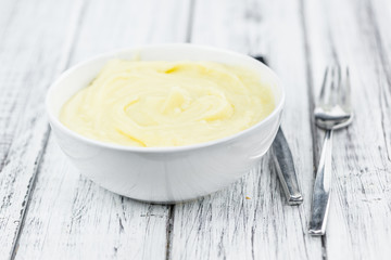 Mashed Potatoes (selective focus) on vintage wooden background