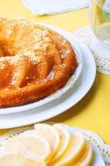 Yellow summer table setting with lemon bundt cake