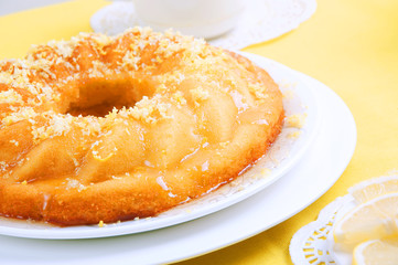 Yellow summer table setting with lemon bundt cake