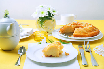 Yellow summer table setting with lemon bundt cake